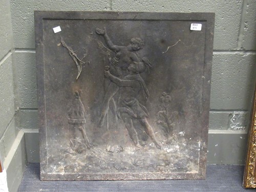 Lot 675 - A cast iron square fire back decorated with...