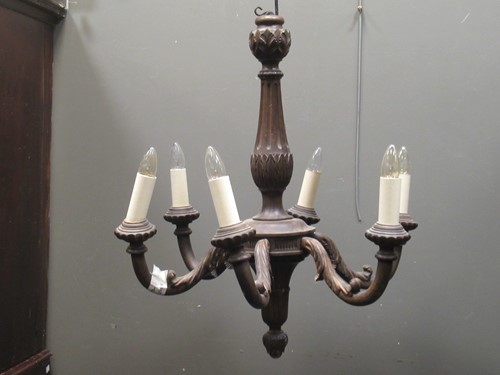 Lot 649 - A carved wood six branch chandelier approx...