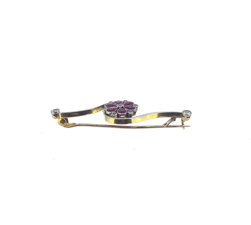 Lot 47 - An early 20th century synthetic ruby and diamond flower brooch