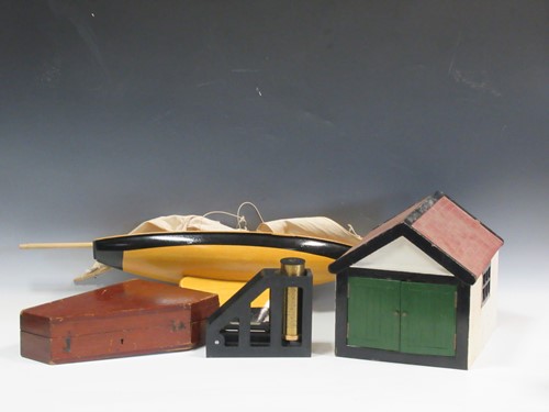 Lot 128 - A Clinometer, a pond yacht and a 1930s hand...
