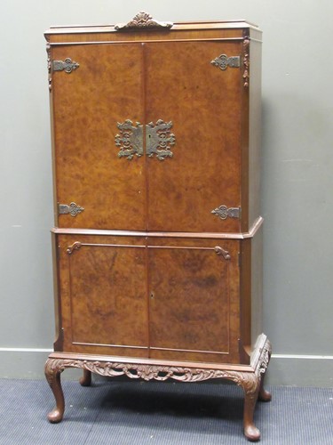 Lot 691 - A 1930's walnut cocktail cabinet