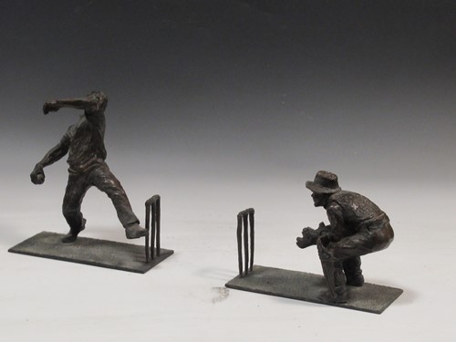 Lot 103 - A pair of bronze cricketing bookends by Elaine...