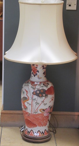 Lot 677 - A Chinese style ceramic lamp with shade