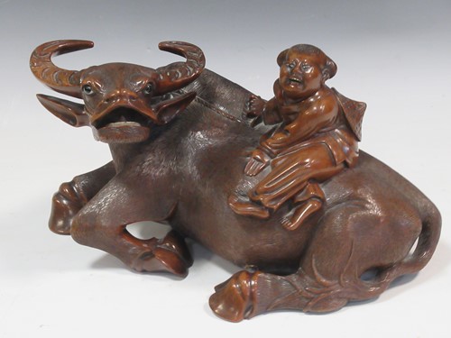 Lot 36 - An Asian carved hardwood water buffalo with...