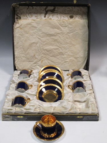 Lot 79 - A cased Limoges coffee service, the blue...