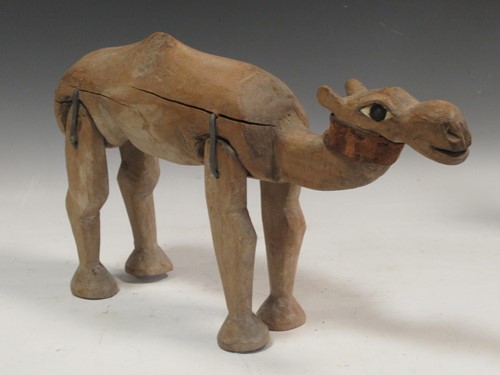 Lot 31 - A carved wood dromedary camel Provenance: The...