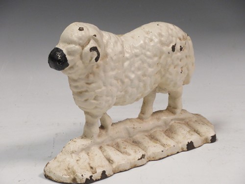 Lot 171 - A cast iron door stop modelled as a ram, 19 x...