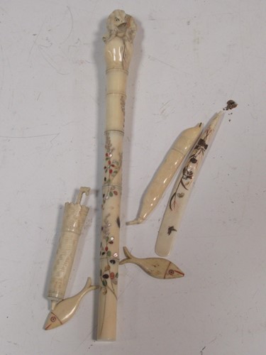 Lot 110 - An ivory parasol handle, the finial carved...