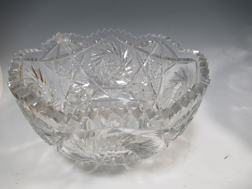 Lot 10 - A massive cut glass Punch bowl, A similar...