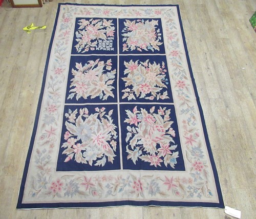 Lot 728 - A needle point floor covering decorated with...