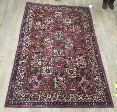 Lot 726 - A Garden rug, 242 x 152cm