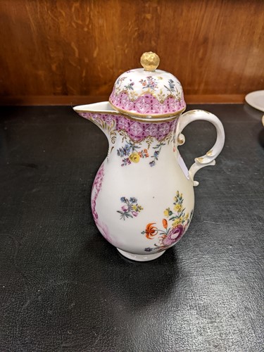 Lot 74 - A continental porcelain small jug and cover...
