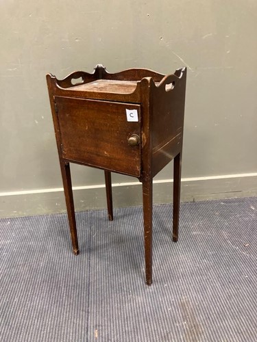 Lot 608 - A mahogany tray top bedside cabinet on square...