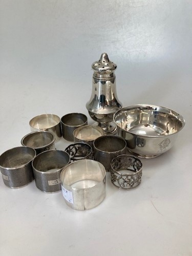 Lot 190 - A collection of silverware including napkin...