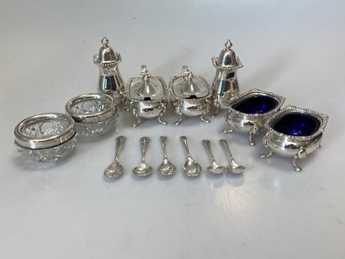 Lot 186 - Two silver three piece condiment sets with...