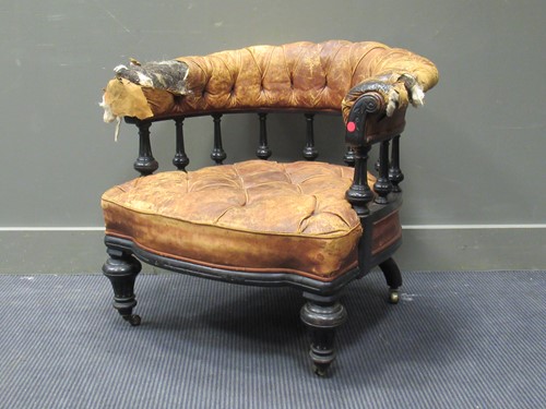 Lot 437 - A late Victorian ebonised library armchair,...