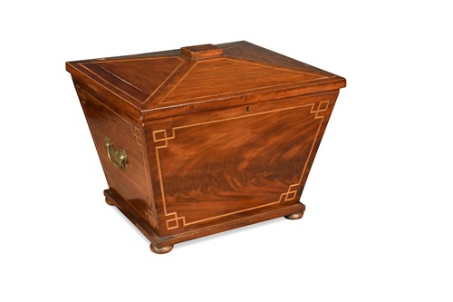 Lot 603 - A flame mahogany sarcophagus shaped cellarette, 19th century