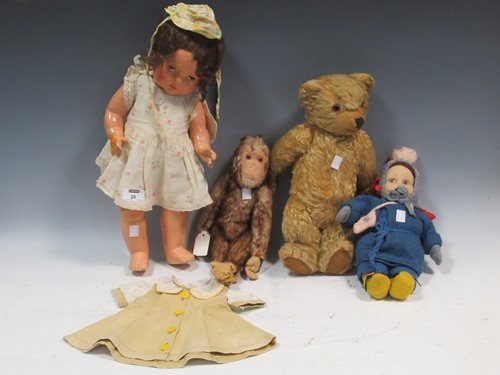 Lot 20 - A teddy bear, felt head doll, stuffed toy...