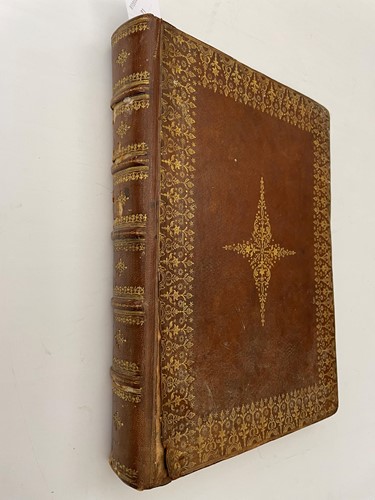 Lot 295 - A leather scrap album, with mounted trimmed...