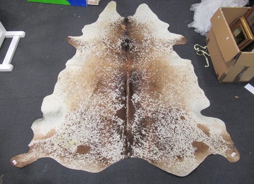 Lot 148 - A cow hide rug, app. 235cm long