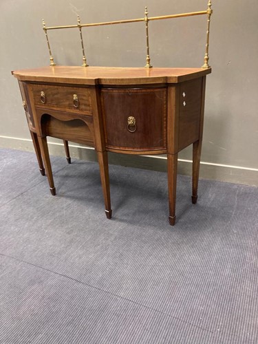 Lot 582 - A George III crossbanded mahogany sideboard...