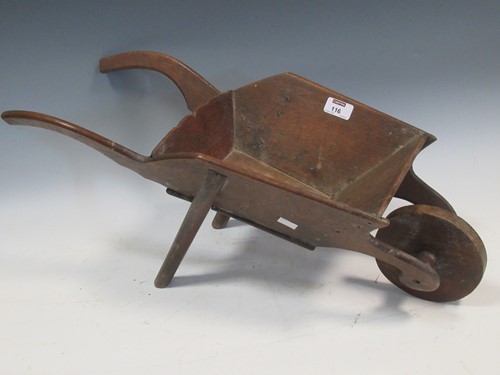 Lot 116 - A miniature oak wheelbarrow, early 20th...
