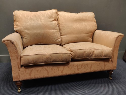 Lot 612 - A modern two seater sofa with fire regulations,...