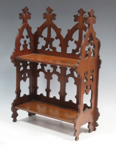 Lot 128 - A small folding Gothic style walnut wall shelf...