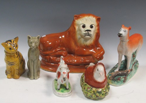 Lot 95 - A Staffordshire model of a whippet/grey hound...