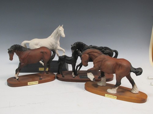 Lot 79 - Four models of horses on wooden plinth, to...