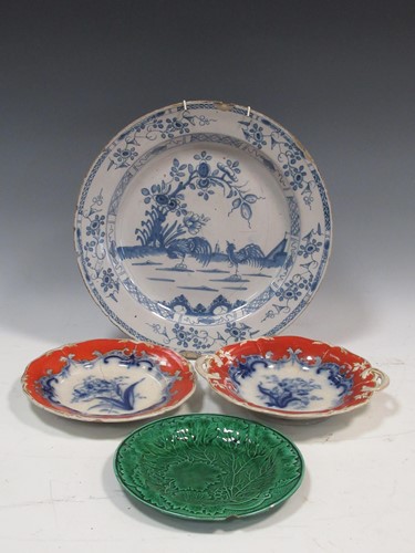 Lot 86 - A blue and white charger decorated with two...