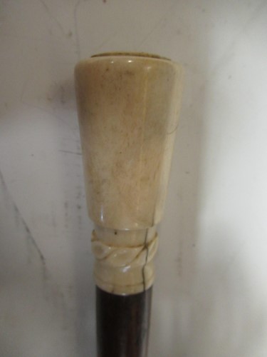 Lot 99 - An ivory topped walking stick, 89cm long