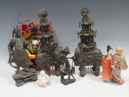 Lot 111 - A pair of Chinese soft base metal elephant...