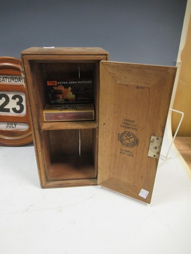 Lot 43 - A small pine tobacco cupboard, branded inside...