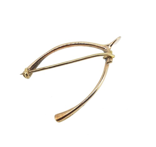 Lot 28 - A Victorian pearl and diamond wishbone brooch