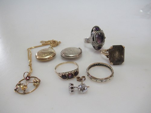 Lot 239 - A hallmarked 9ct gold garnet ring, a smokey...