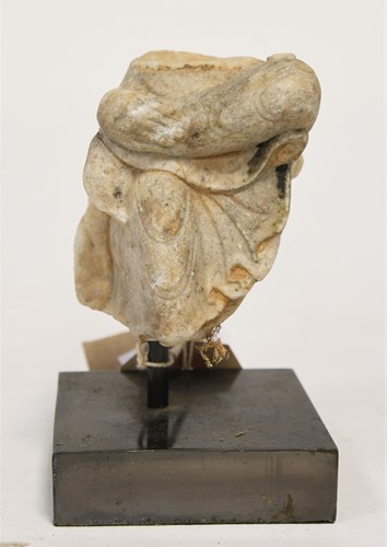 Lot 90 - A Chinese white marble figure of a Buddhist deity, perhaps Tang Dynasty, late 6th/7th century
