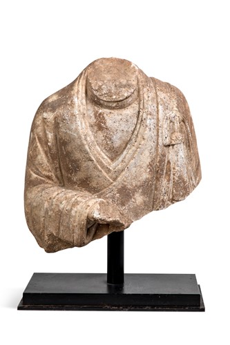 Lot 81 - A Chinese white marble fragmentary bust of a Buddhist deity, Wei style
