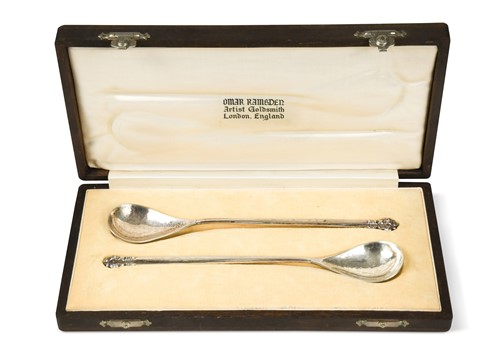 Lot 175 - A cased pair of silver preserve spoons by Omar Ramsden