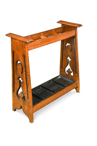 Lot 186 - An Arts & Crafts oak umbrella/stick stand