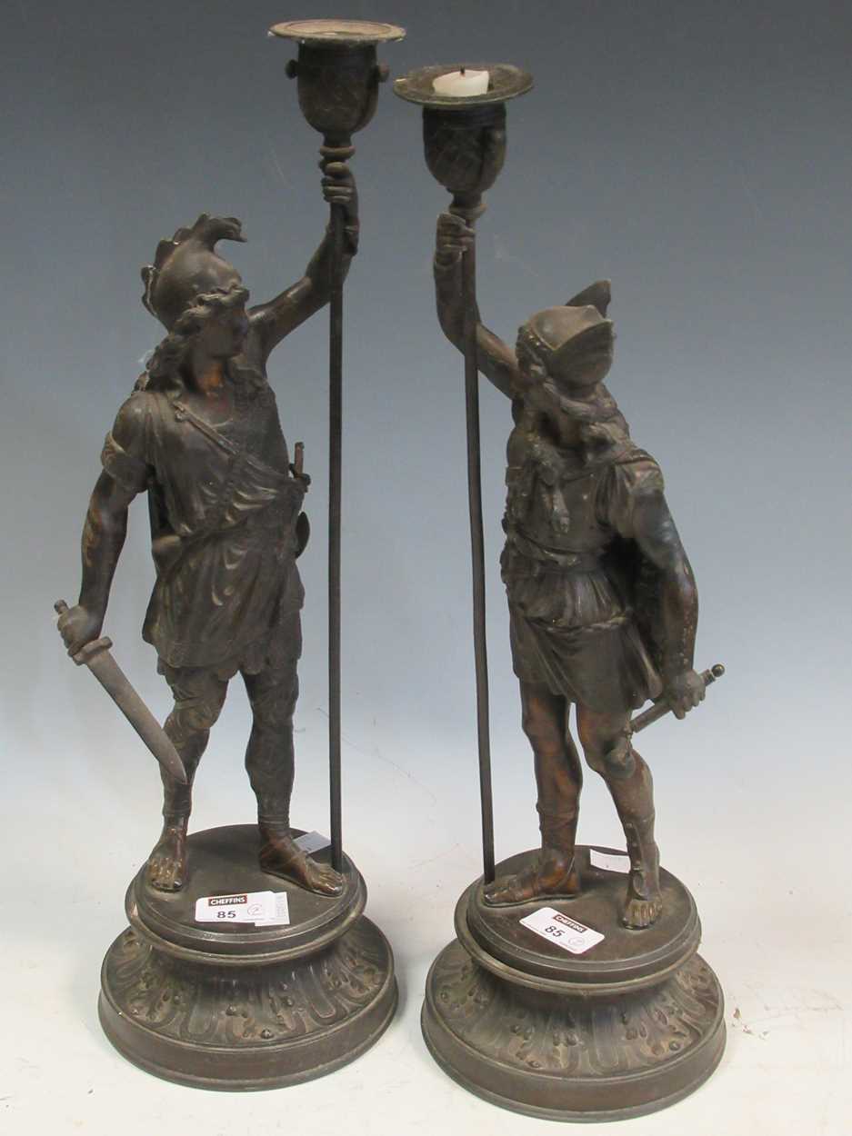 Lot 35 - A pair of spelter candlesticks modelled as...