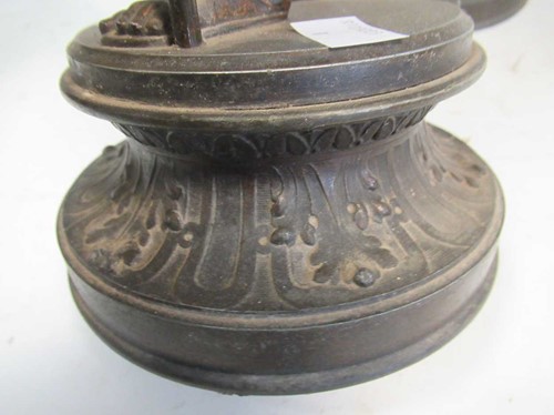 Lot 35 - A pair of spelter candlesticks modelled as...
