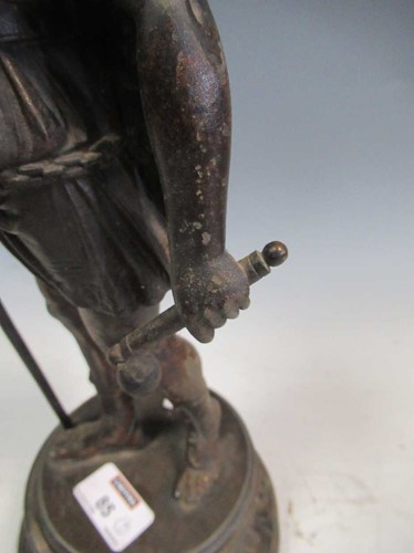 Lot 35 - A pair of spelter candlesticks modelled as...