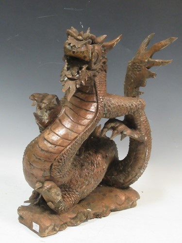 Lot 82 - A carved wood model of a dragon, 43cm high,...