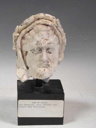 Lot 31 - A plaster model of Christ's head on a black...