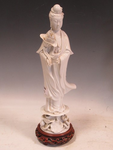 Lot 113 - A Chinese Blanc de Chine model of Guanyin,...