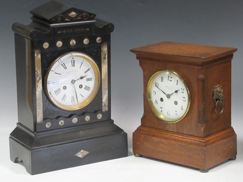 Lot 19 - An early 20th oak cased mantle clock retailed...