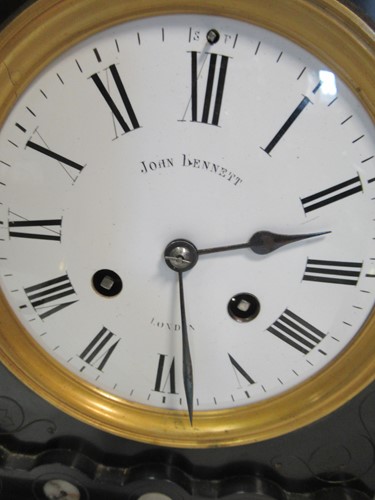 Lot 19 - An early 20th oak cased mantle clock retailed...