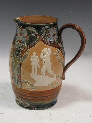 Lot 40 - A Doulton Lambeth golf jug, 24cm high