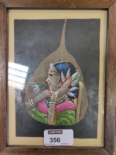 Lot 356 - A Modern Indian painting of a woman holding a...